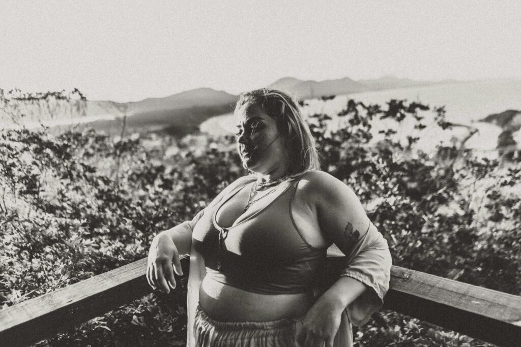 a woman sitting on a ledge