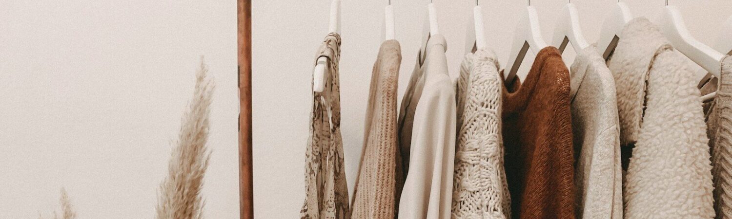 Photo by Alyssa Strohmann hanged top on brown and white clothes horse