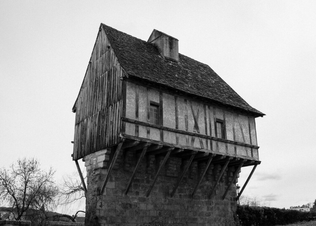 Ancient, wooden house with a unique design.